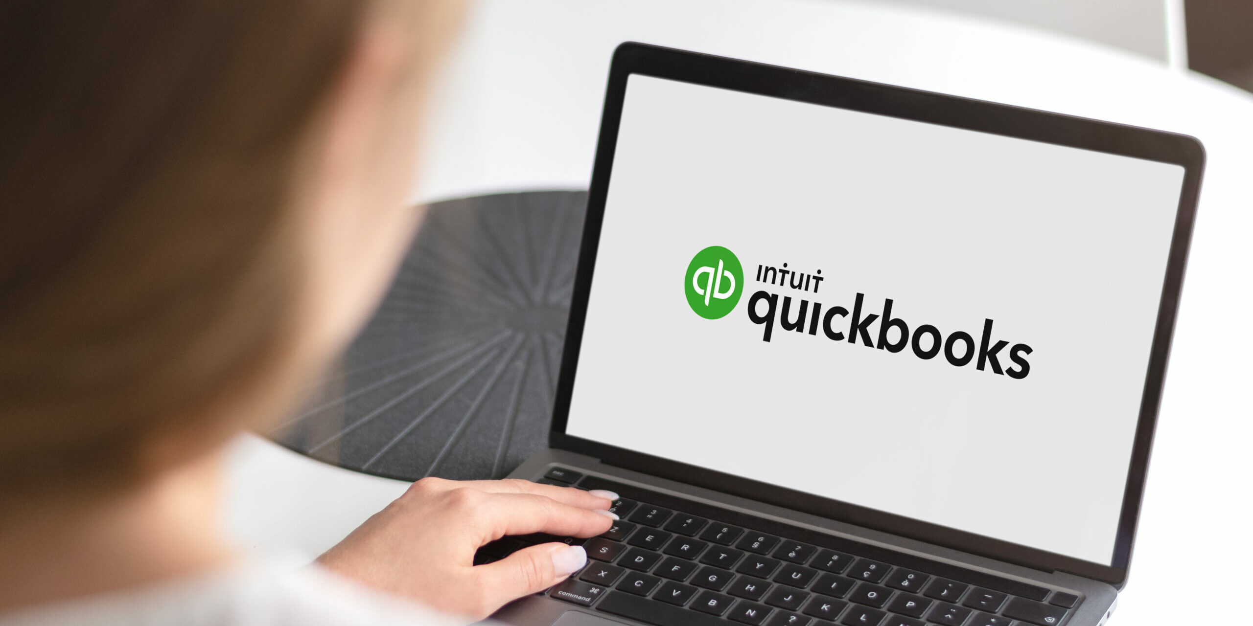 Guilherand-Granges, France - October 21, 2020. Notebook with Intuit Quickbooks logo. American accounting software service for small and medium-sized businesses.